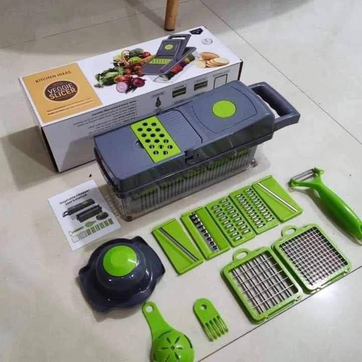 Vegetable slicer set with packaging on a tiled floor