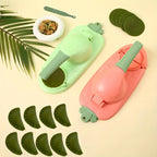 Two green and pink dumpling makers with green dumpling skins on a beige background.