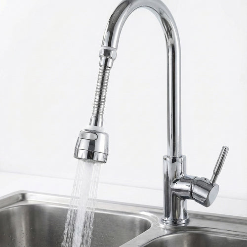 Chrome kitchen faucet with a pull-out spray head over a sink.
