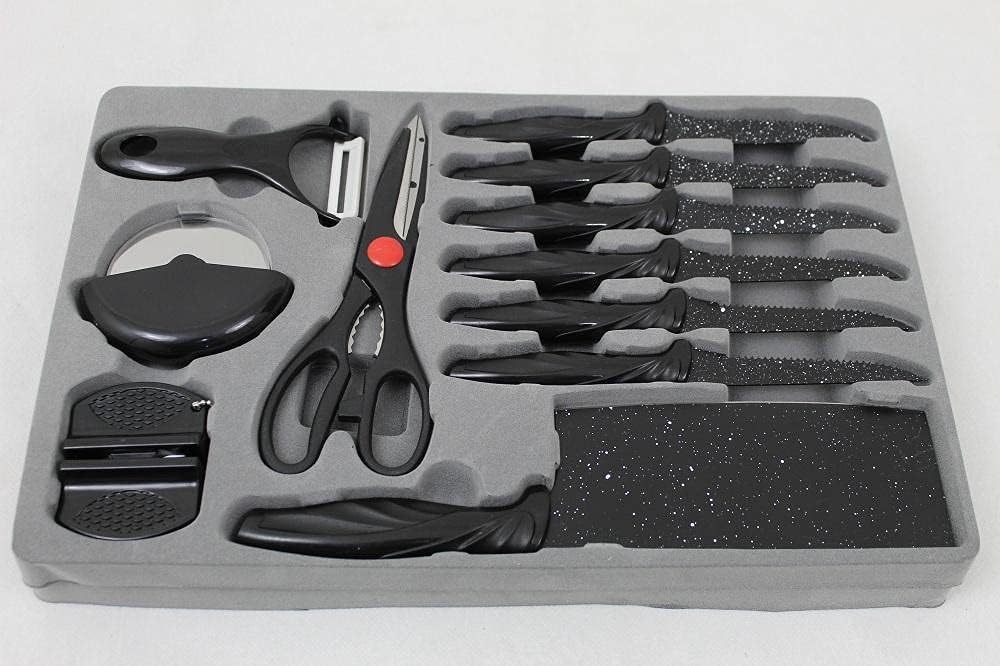 Set of kitchen knives and tools in a gray case on a white background