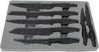 Set of knives with black handles in a gray foam tray