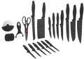 Set of black kitchen knives and tools on a white background