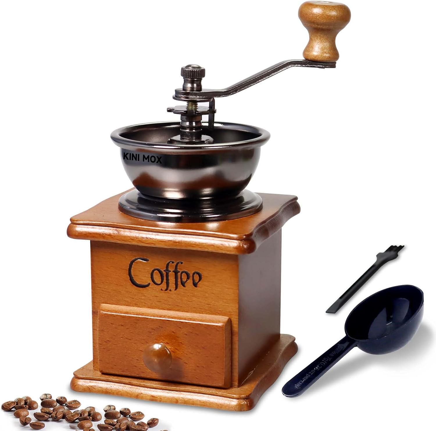 Wooden coffee grinder with a black bowl, surrounded by coffee beans and a black scoop on a white background.