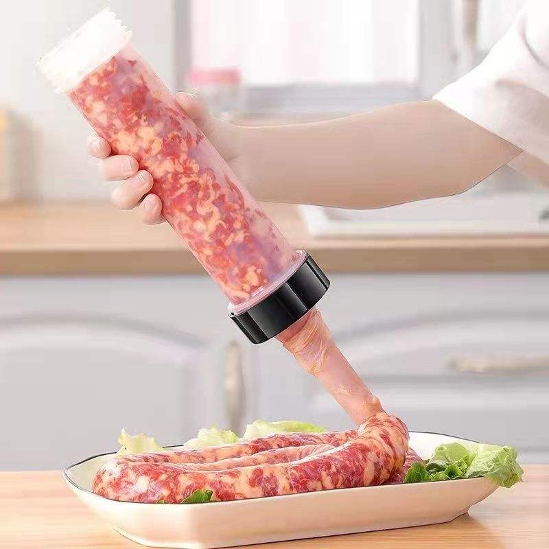Person using a meat grinder to prepare ground meat on a plate with vegetables.