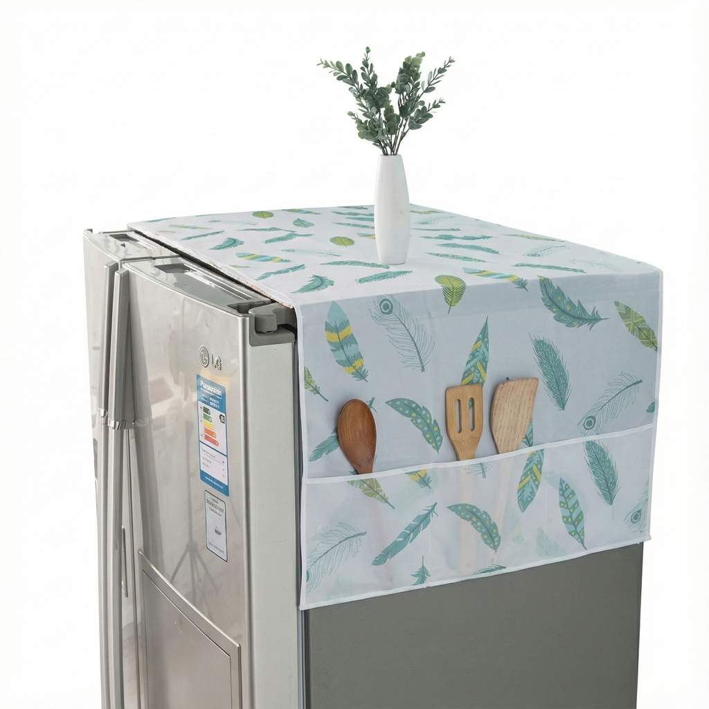 Fridge with a decorative cover featuring kitchen utensils and plants on a white background
