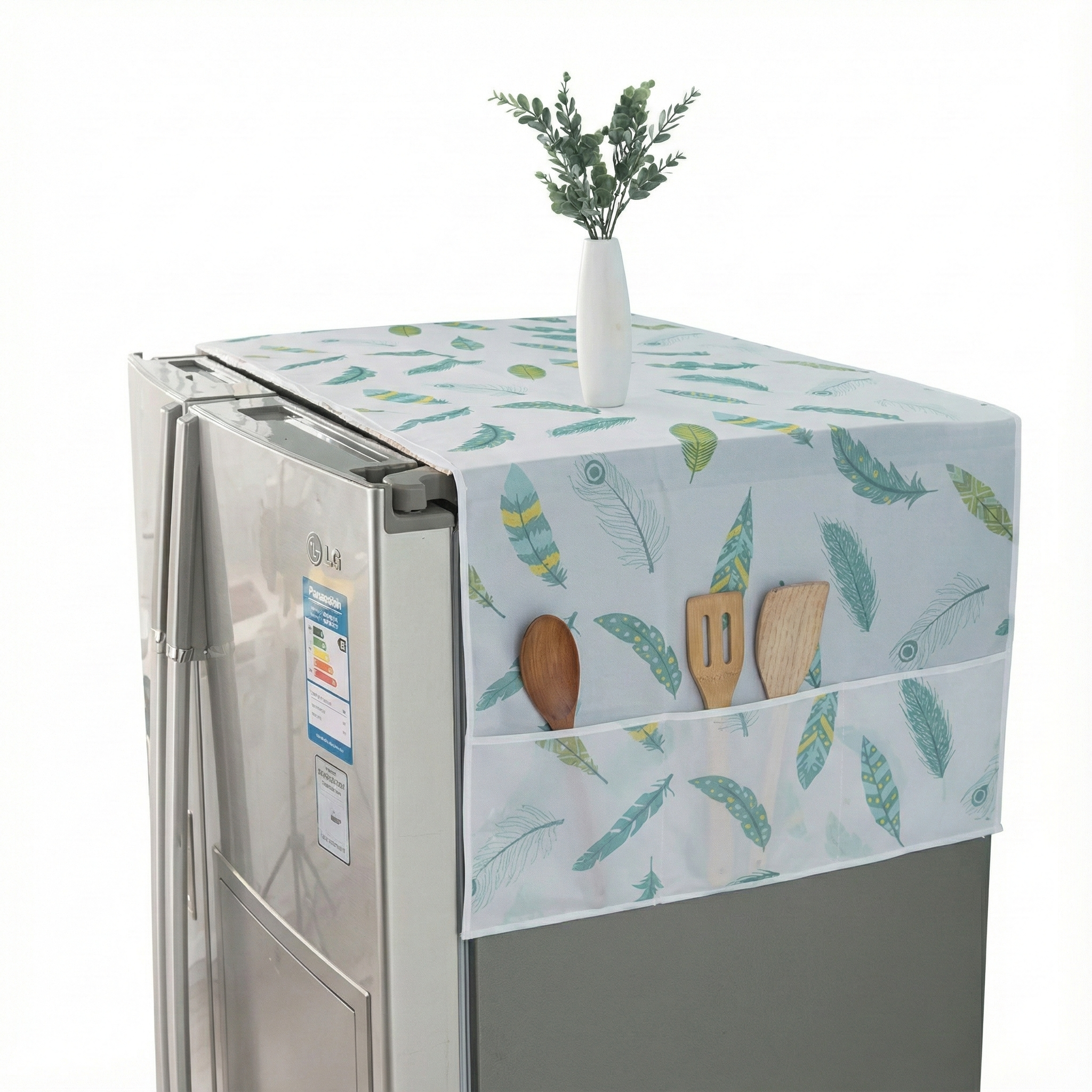Fridge with a decorative cover featuring kitchen utensils and plants on a white background