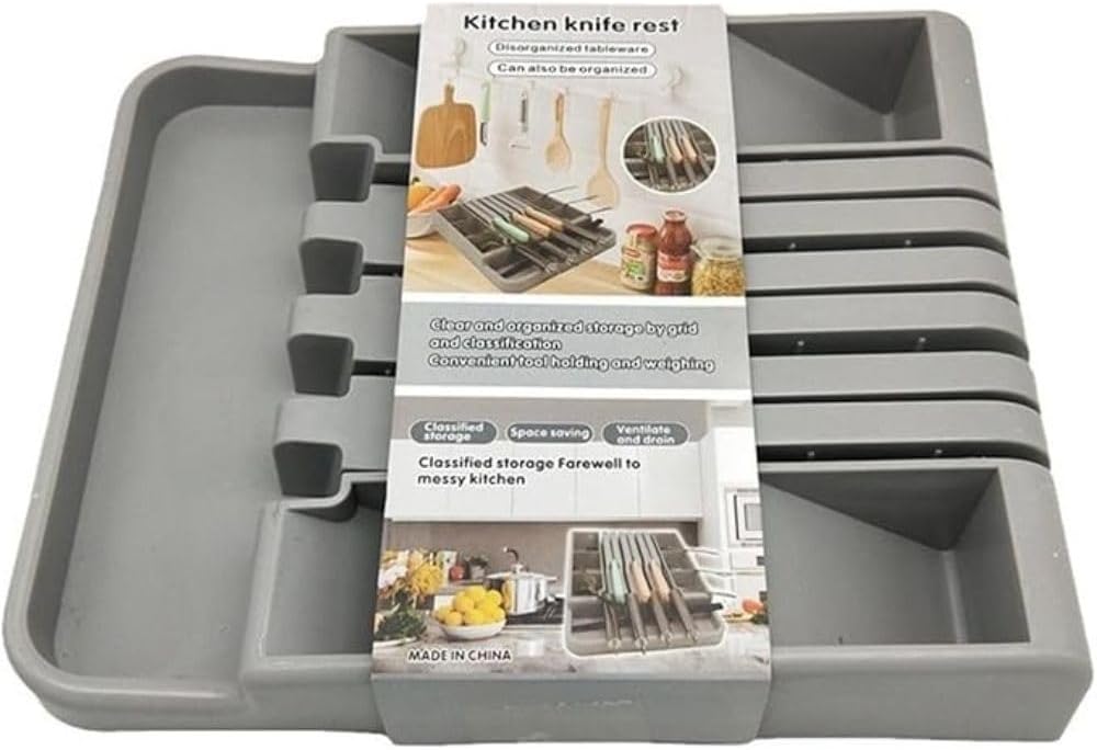 Gray kitchen knife rest with packaging on a white background