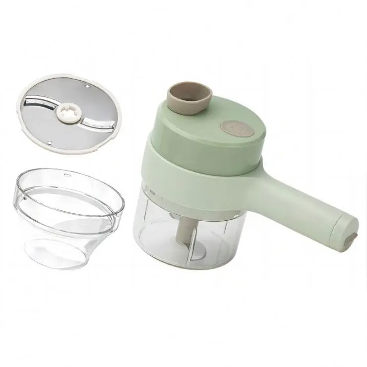 Green kitchen chopper with clear container and silver blade on a white background