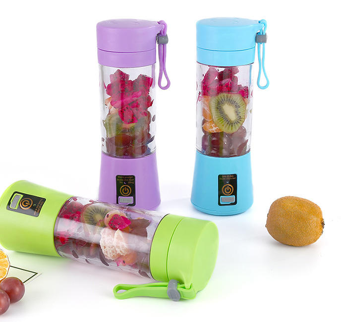 Three colorful portable fruit infusers with fruits inside on a white background