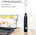 Black USB rechargeable hand mixer on a wooden surface with a laptop displaying a recipe.