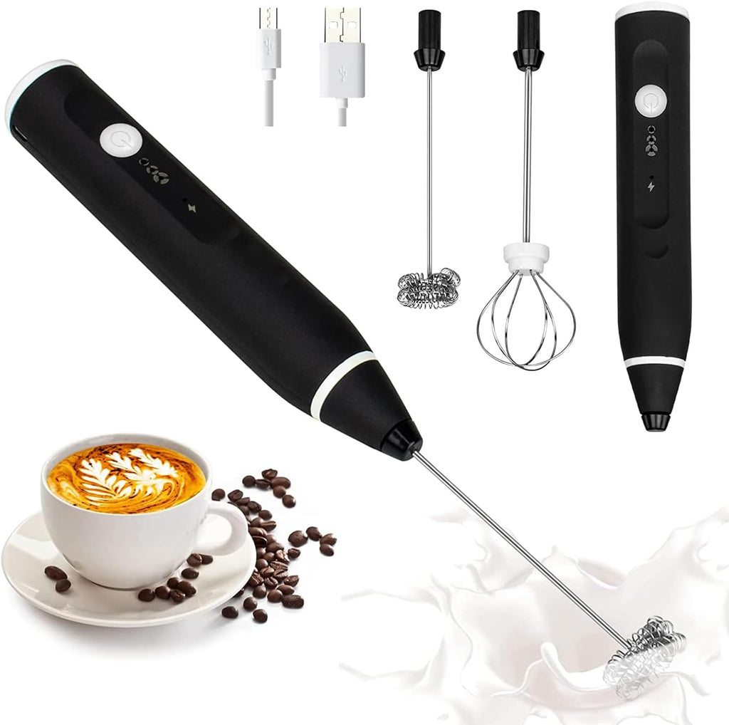 Black handheld milk frother with attachments near a cup of coffee and beans.