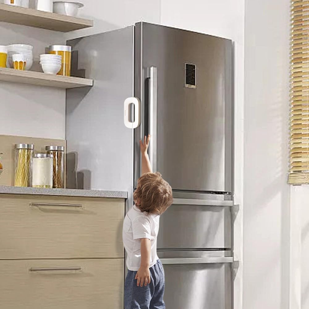 Child reaching for a stainless steel refrigerator in a kitchen.