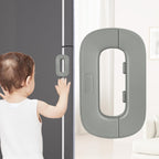 Child trying to open a door with a safety lock mechanism.