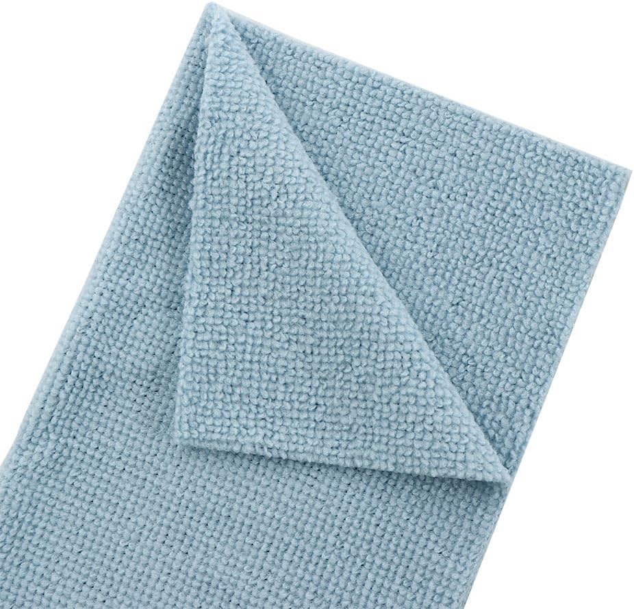 Folded light blue towel on a white background