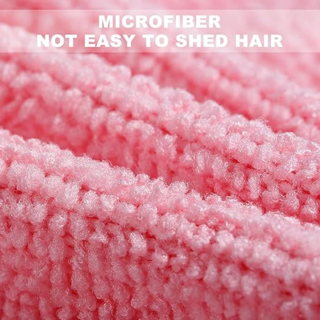 Close-up of pink microfiber fabric with text 'MICROFIBER NOT EASY TO SHED HAIR'.