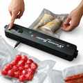 Vacuum sealer with food packaging on a white surface