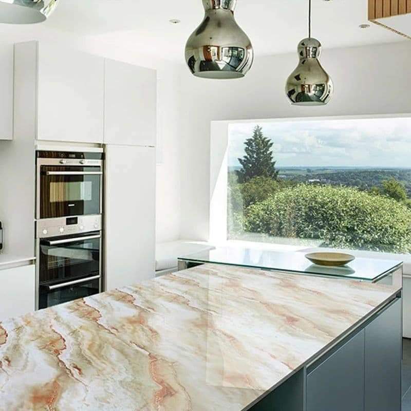 Modern kitchen with marble island and stainless steel appliances