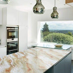 Modern kitchen with marble island and stainless steel appliances
