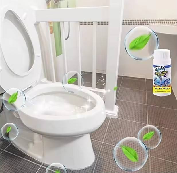 White toilet with a bottle of cleaning product on a tiled bathroom floor.
