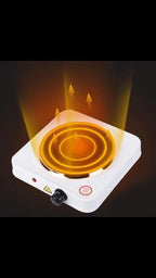 Small electric stove with glowing coil and arrows indicating heat direction on a dark background